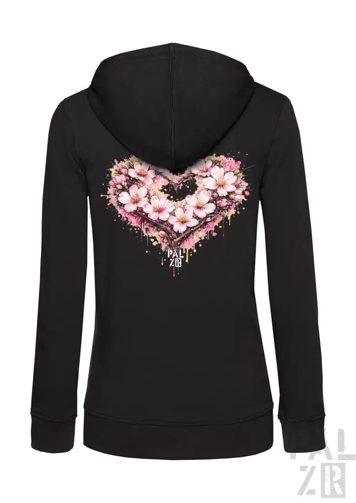 Schwarzes Reißverschluss-Hoodie mit einem lebendigen pinken Kirschblüten-Herz-Design mit Spritzeffekten und dem Markennamen „pall zor“ darunter.