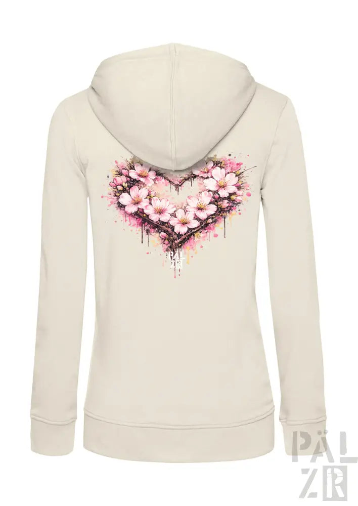 Cremeweißer Hoodie mit einem lebendigen pinken Kirschblüten-Herz-Design und Aquarell-Spritzereffekten auf der Rückseite.
