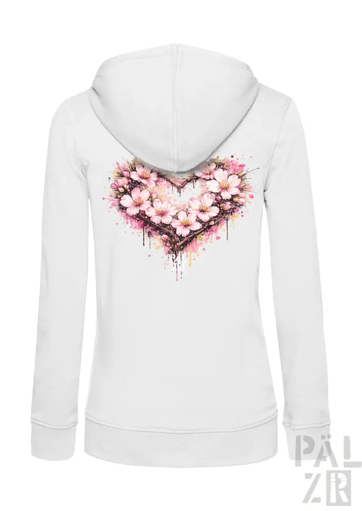 Weiße Kapuzenjacke mit Reißverschluss, die ein lebendiges, pinkfarbenes Kirschblüten-Herz-Design mit Aquarell-Spritzereffekten auf der Rückseite aufweist.