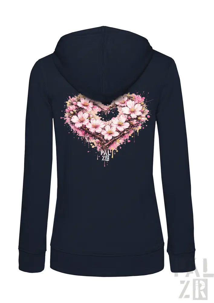 Marineblaue Kapuzenjacke mit Reißverschluss und einem lebendigen pinken Kirschblüten-Herz-Design mit Spritzereffekten und dem Text „pall zen“ darunter