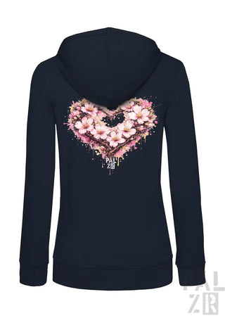 Marineblaue Kapuzenjacke mit Reißverschluss und einem lebendigen pinken Kirschblüten-Herz-Design mit Spritzereffekten und dem Text „pall zen“ darunter