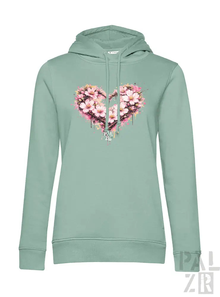 Minzgrüner Hoodie mit einem lebendigen pink-weißen floralen Herzdesign und tropfenden Farbeffekten.