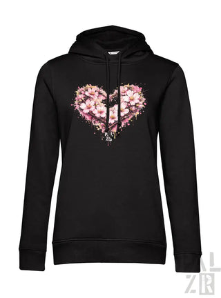Schwarzer Hoodie mit einem lebendigen pink- und weiß-blumigen Herz-Design mit Spritzeffekten über der Brust.