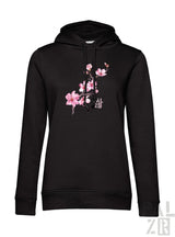 Schwarzer frauen hoodie mit zartem rosa mandelzweig grafik vorne in verschiedenen farben erhältlich