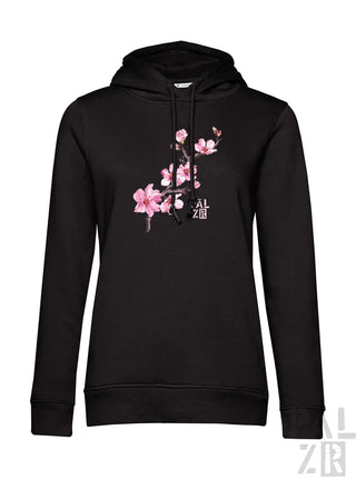 Schwarzer frauen hoodie mit zartem rosa mandelzweig grafik vorne in verschiedenen farben erhältlich