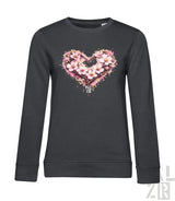 Dunkelgraues Langarm-Sweatshirt mit einem lebendigen pink-weißen Blumenherz-Design und Spritzeffekten.