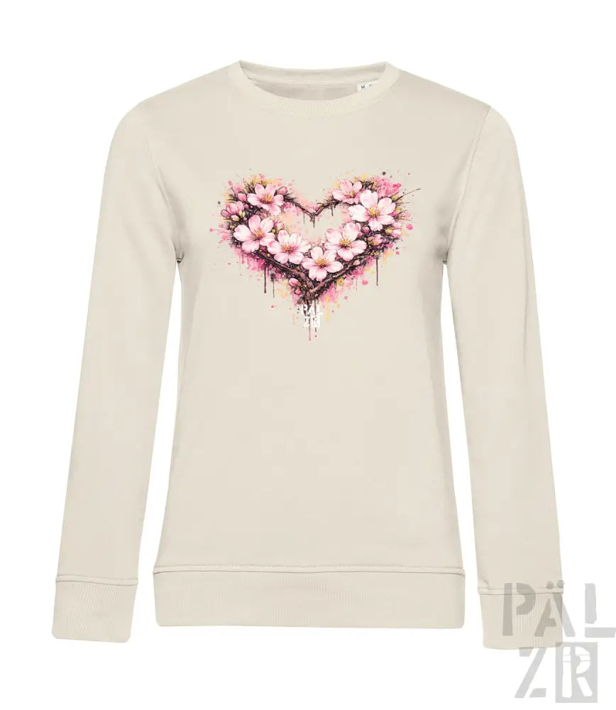 Cremeweiße Langarm-Sweatshirt mit einem lebendigen pink-weißen Blumenherz-Design und Aquarell-Spritzereffekten.
