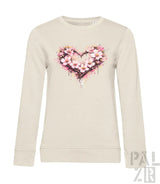 Cremeweiße Langarm-Sweatshirt mit einem lebendigen pink-weißen Blumenherz-Design und Aquarell-Spritzereffekten.