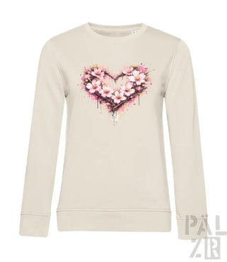Cremeweiße Langarm-Sweatshirt mit einem lebendigen pink-weißen Blumenherz-Design und Aquarell-Spritzereffekten.