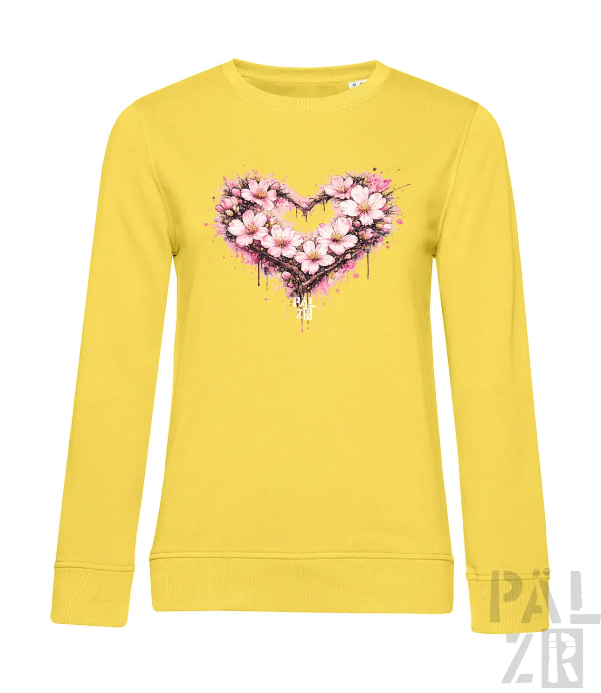 Ein lebendiges gelbes Langarm-Sweatshirt mit einem herzförmigen Blumenmuster aus pinken Blüten und Spritzfarbeffekten.