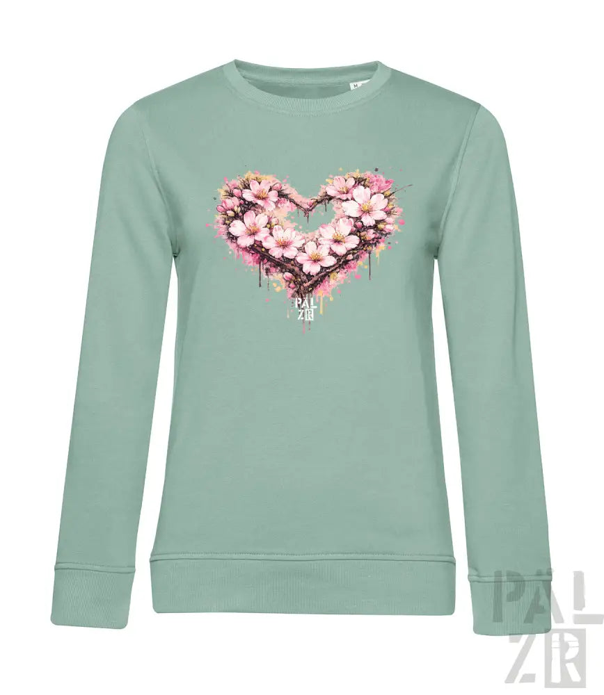 Minzgrüner Langarm-Sweatshirt mit einem lebendigen herzförmigen Blumenmuster mit pinken Blüten und Spritzdetails.