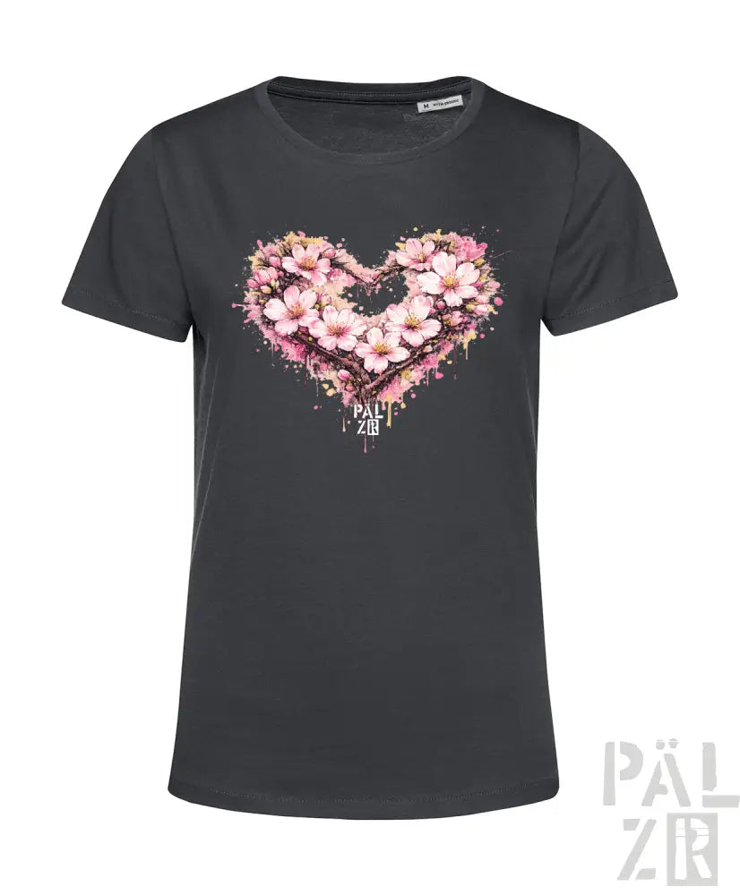 Dunkelgraues Damen-T-Shirt mit einem lebendigen pink-weißen Blumenherz-Design und Spritzeffekten.