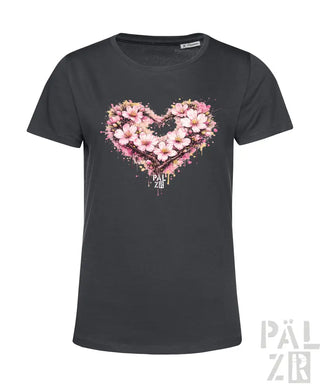 Dunkelgraues Damen-T-Shirt mit einem lebendigen pink-weißen Blumenherz-Design und Spritzeffekten.