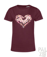 Bordeauxfarbene kurzärmelige T-Shirt mit einem lebendigen herzförmigen Blumenmuster mit pinken Blüten und Spritzeffekten.