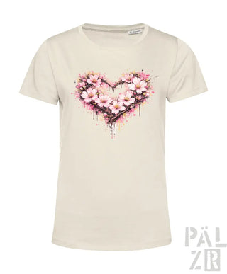 Cremeweißes Damen-T-Shirt mit einem lebendigen pinken Kirschblüten-Herz-Design und Spritzeffekten.