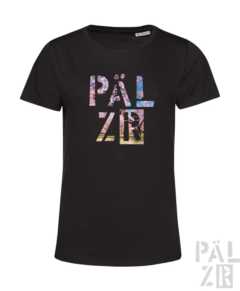 Schwarzes T-Shirt mit farbenfrohem Blumenmuster und Text ’päl zr’.