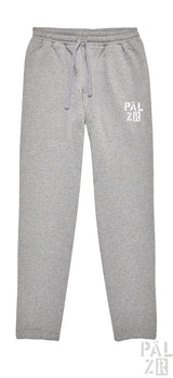 Graue Jogginghosen mit ‚palzir‘-Logo auf dem Bein.