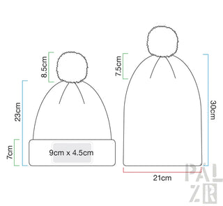 Wintermütze mit Bommel, schwarz-weißes Design, aus Wolle oder Acryl.