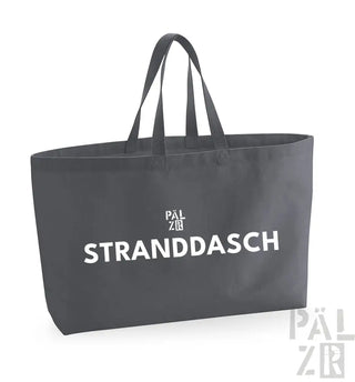 Kohle-graue Umhängetasche mit weißem Text und Logo, mit ’stranddasch’ prominent dargestellt.