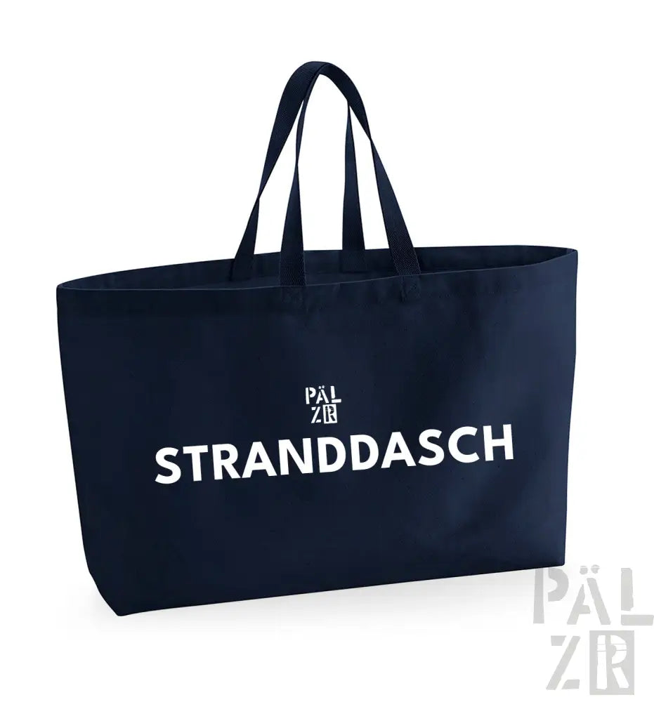 Marineblaue Tragetasche mit weißem Text und Logo, ’stranddasch’ Design.