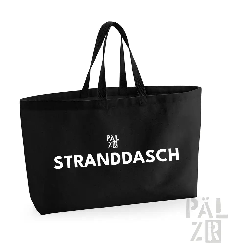 Schwarze Umhängetasche mit weißem Text und Logodesign, mit ’stranddasch’ prominent dargestellt.