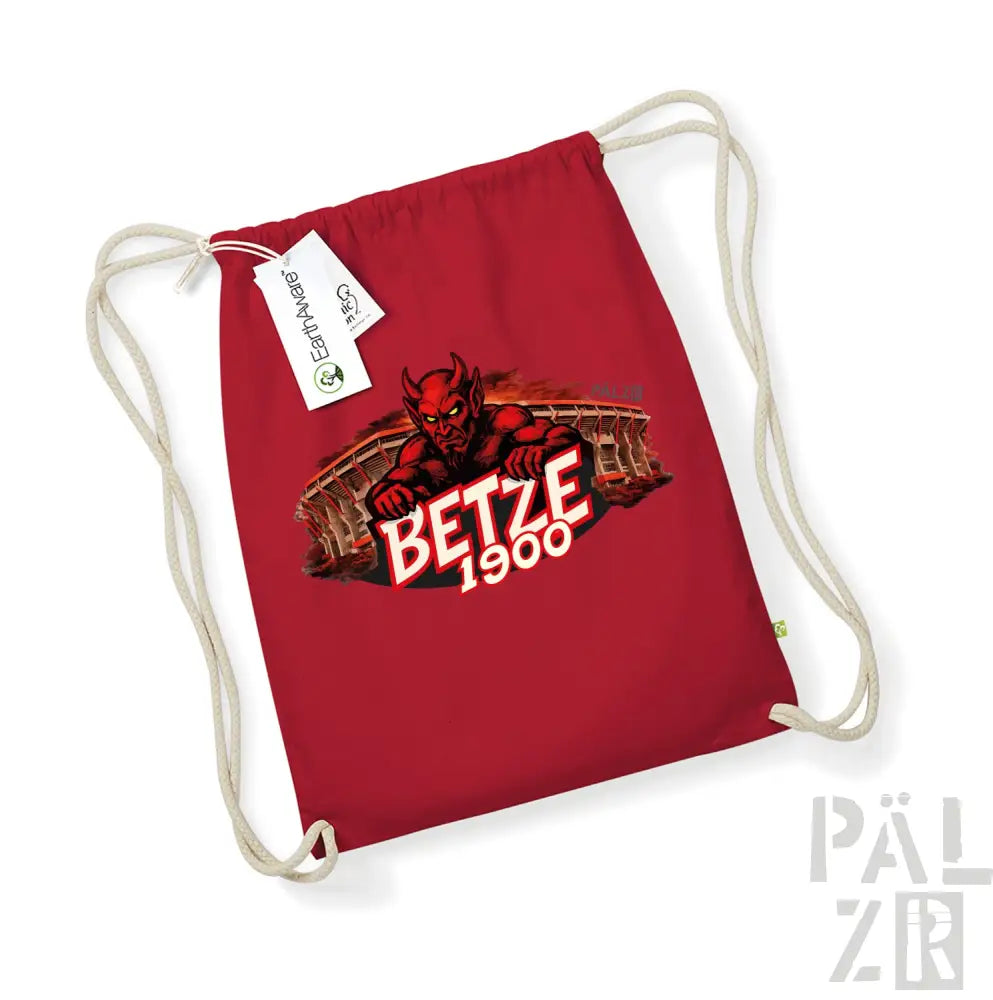 Roter Kordelbeutel mit Grafik eines roten Teufels mit Text „betze 1900“ und Stadion-Motiven.