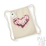 Beige Beutel aus Bio-Baumwolle mit Kordelzug, mit einem lebendigen pinken Kirschblüten-Herz-Design und Spritzereffekten.