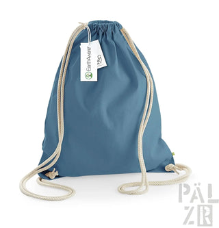 Blaues Rucksack mit Kordelzug, weißen Seilgriffen und einem Etikett.