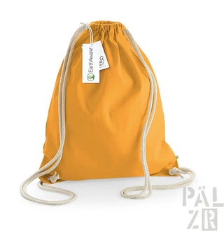 Gelber Rucksack mit Kordelzug, weißen Seilgriffen und einem kleinen Etikett.