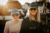 Palzb Baseballkappe mit schwarz-weißem Design, verstellbarer Riemen.